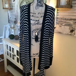 Black and white striped cardigan. Size large
